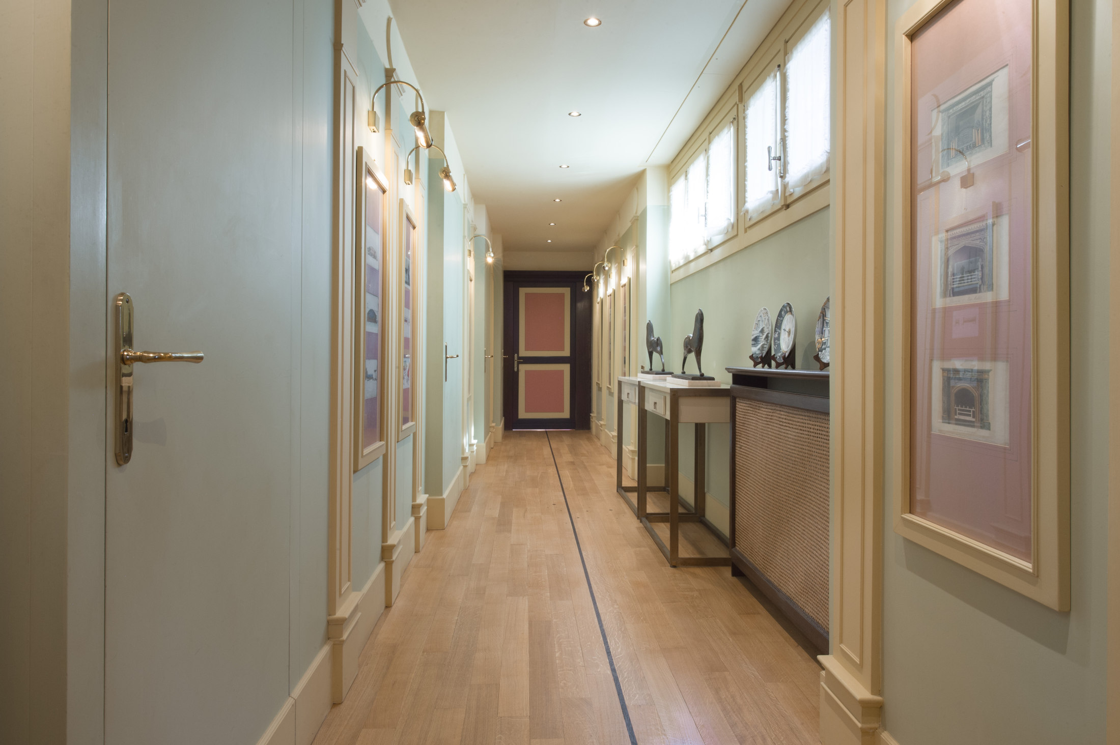 Interior corridor with framed prints and bespoke furnishings