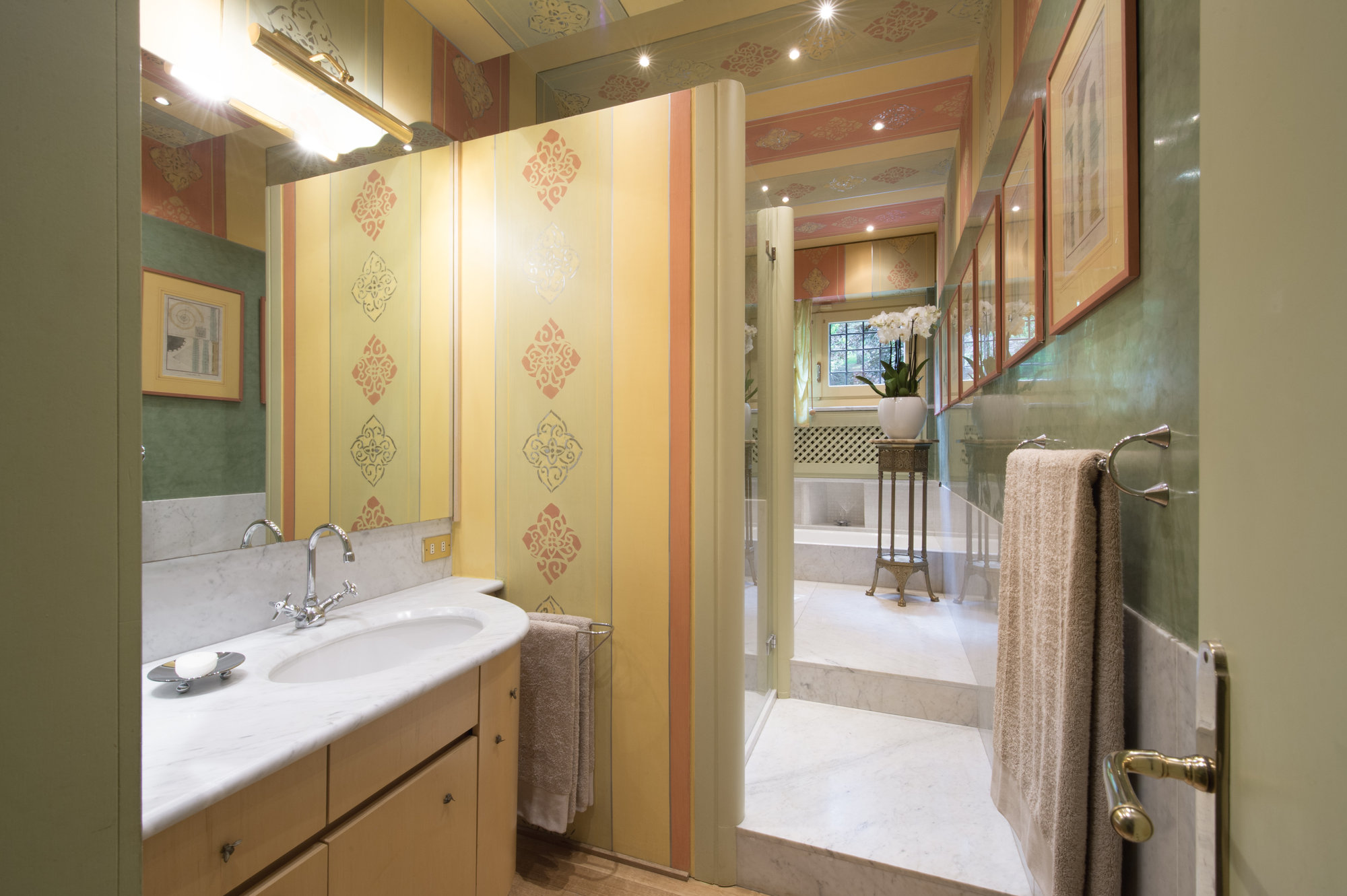 Bathroom with stencilled walls and marble