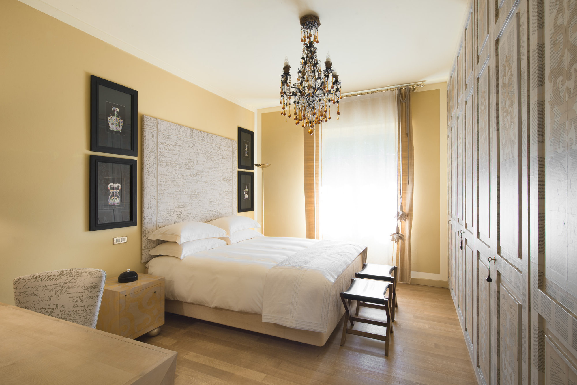 Bedroom with crystal chandelier